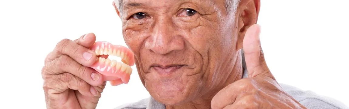 Senior Man with Denture Giving Thumbs Up
